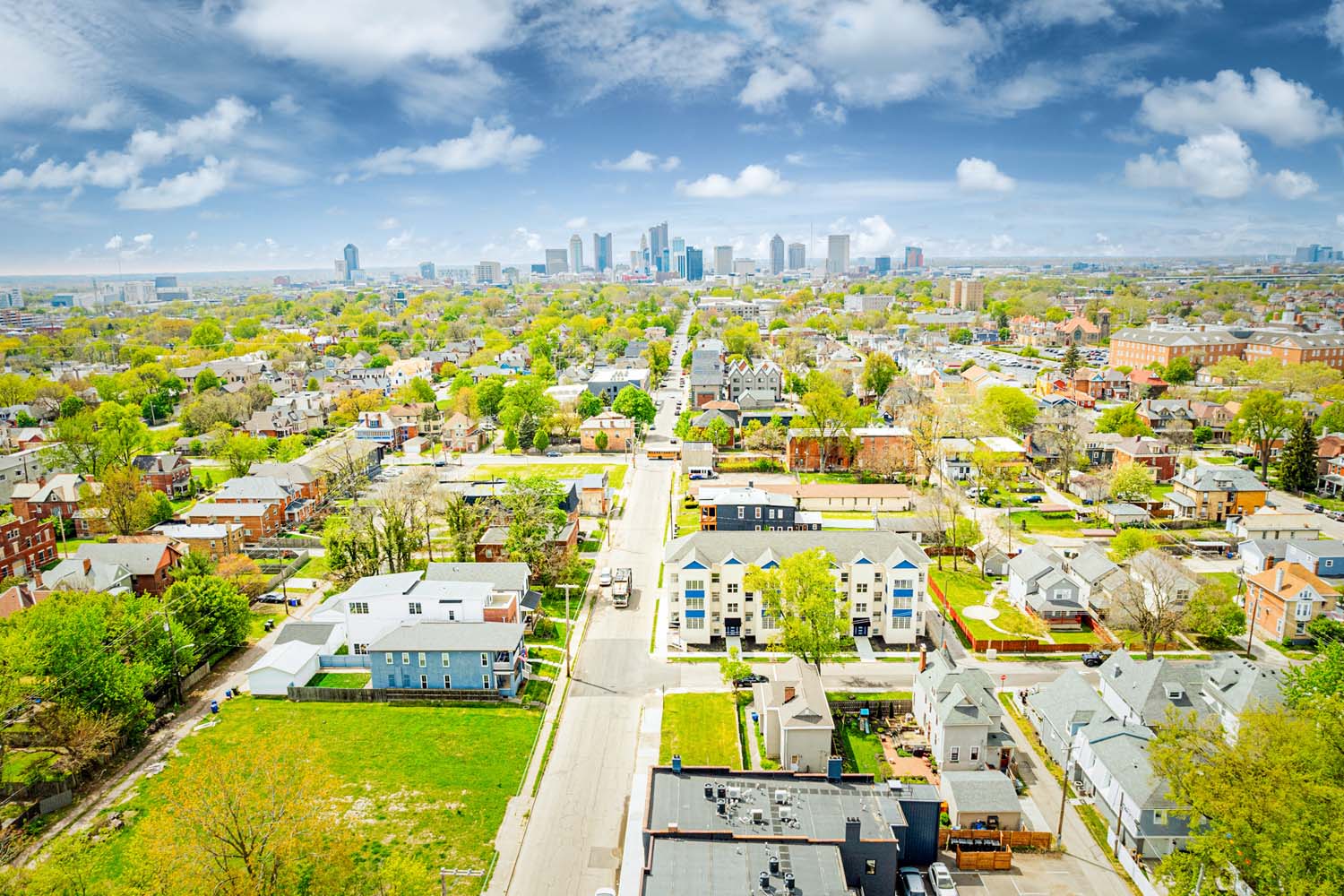 A bustling city skyline with numerous towering buildings, showcasing the urban landscape and its architectural diversity.